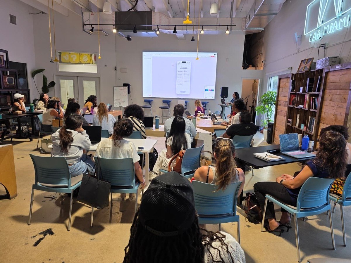 A woman presenting on AI governance to the room